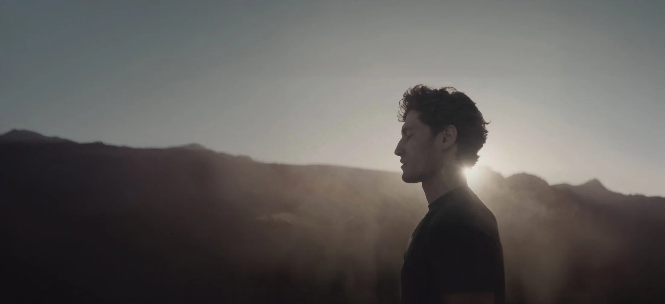 A discipline of place, a silhouette in the quiet light of sunrise
